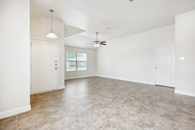 unfurnished room featuring lofted ceiling and ceiling fan