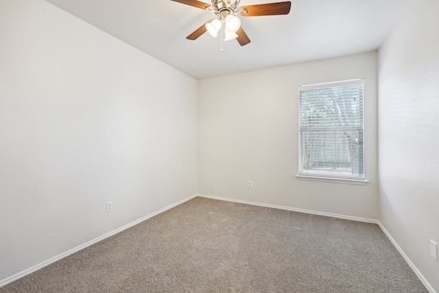 spare room featuring carpet floors and ceiling fan