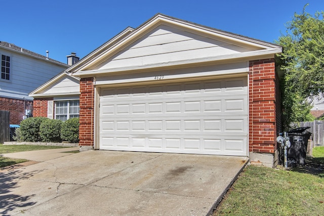 4629 Grant Park Ave, Fort Worth, TX 76137 - view of front of property with a garage, brick siding, and driveway
