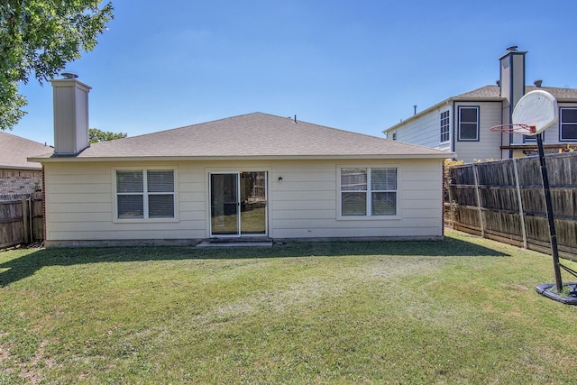 4629 Grant Park Ave, Fort Worth, TX 76137 - back of house featuring a yard, a chimney, fence, and roof with shingles