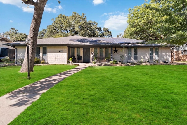 ranch-style home featuring a front yard