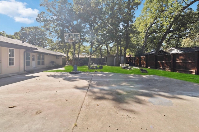 view of patio featuring a storage unit