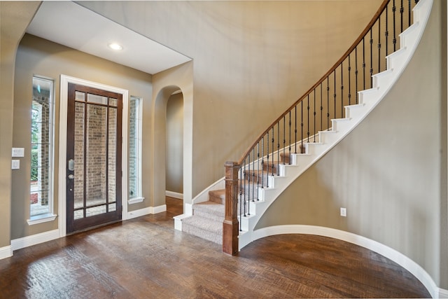 foyer entrance featuring dark wood-type flooring