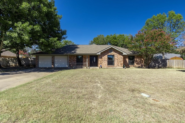 ranch-style home with a front yard and a garage