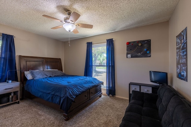 bedroom featuring a textured ceiling, carpet, and ceiling fan