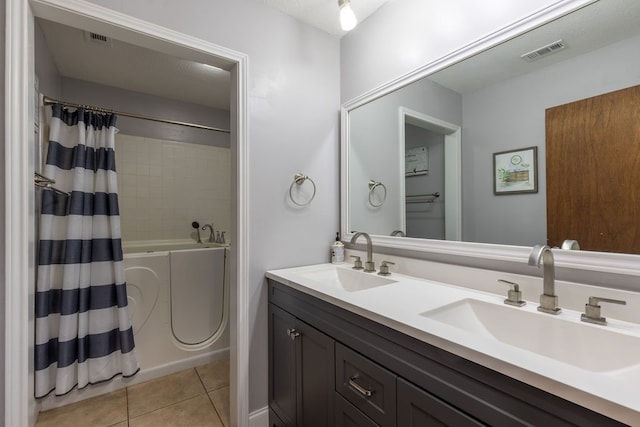 bathroom with vanity, shower / bath combo, and tile patterned floors