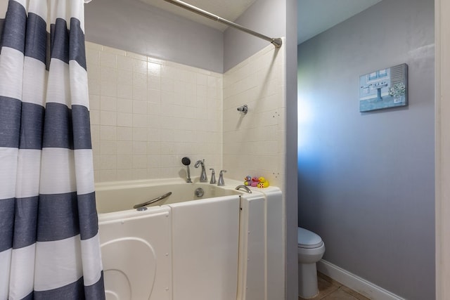 bathroom featuring shower with separate bathtub, tile patterned flooring, and toilet