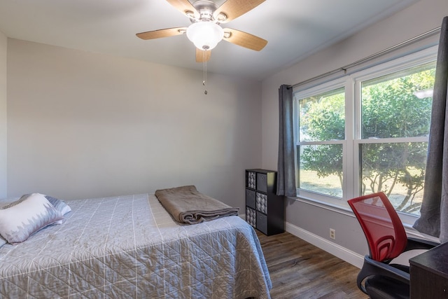 bedroom featuring ceiling fan and hardwood / wood-style floors