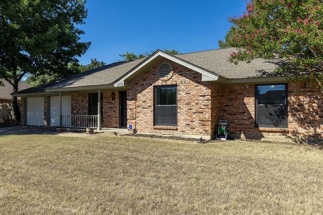 ranch-style home with a garage, a porch, and a front lawn