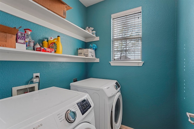 clothes washing area featuring washing machine and clothes dryer