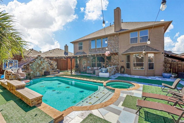 view of swimming pool featuring a patio, an outdoor hangout area, and an in ground hot tub