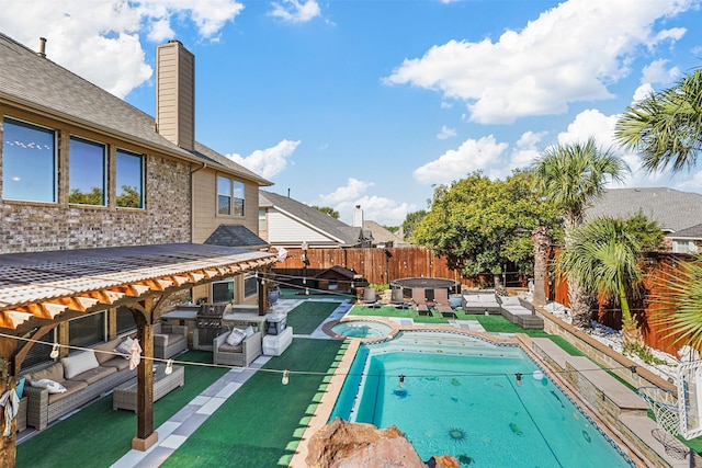 view of swimming pool with an in ground hot tub and a patio area