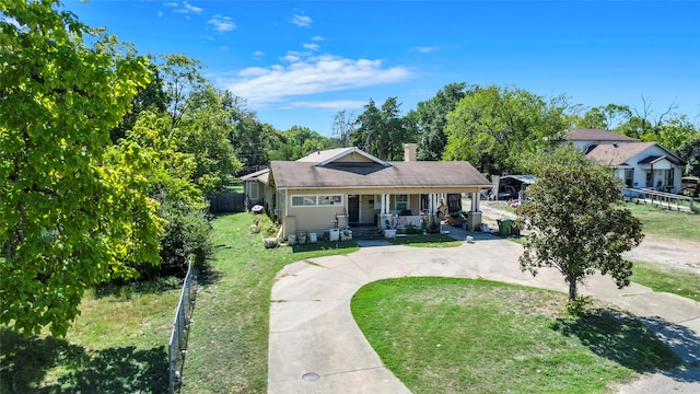 bungalow-style house featuring a porch and a front lawn