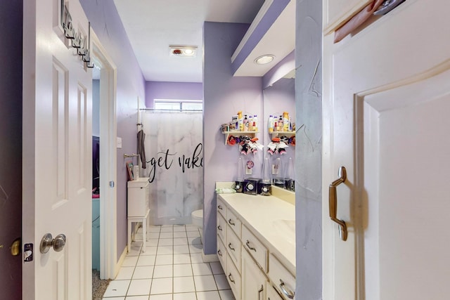 bathroom with tile patterned floors, a shower, vanity, and toilet