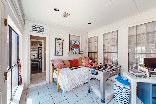 bedroom featuring light tile patterned flooring