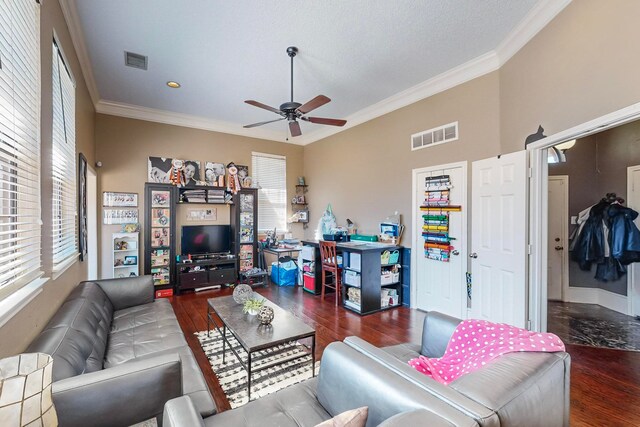 living room featuring ceiling fan, dark hardwood / wood-style floors, and crown molding