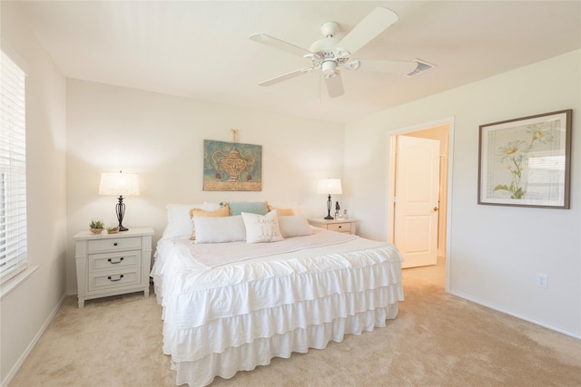 bedroom featuring ceiling fan and light carpet