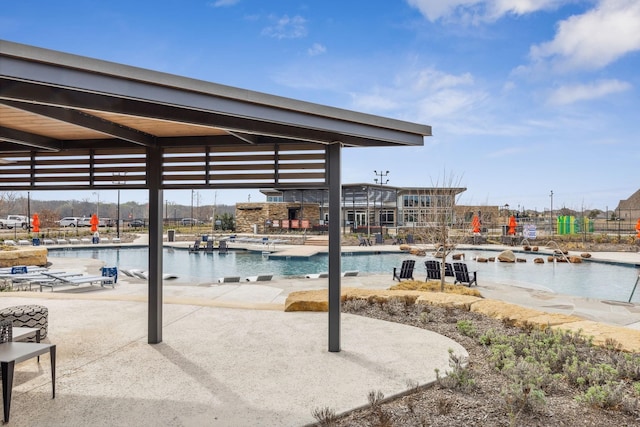 view of swimming pool with a patio area