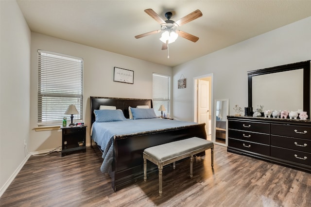 bedroom with ceiling fan and dark hardwood / wood-style floors