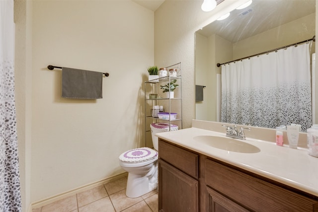 bathroom featuring a shower with shower curtain, tile patterned floors, vanity, and toilet