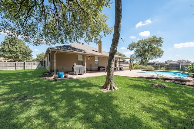 view of yard featuring a fenced in pool and a patio area