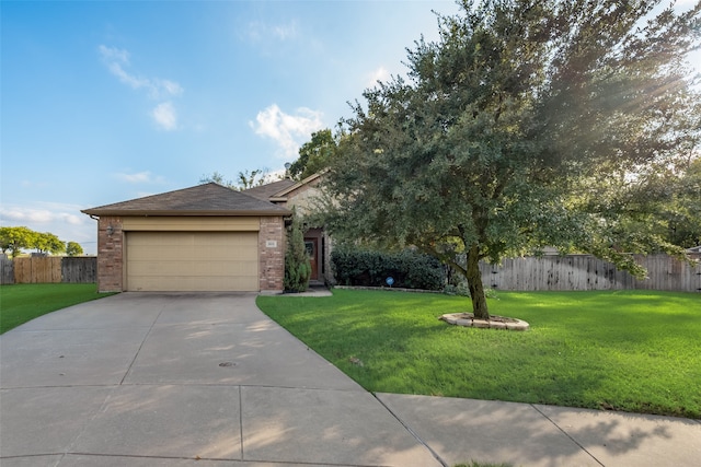 view of front of property featuring a front lawn and a garage