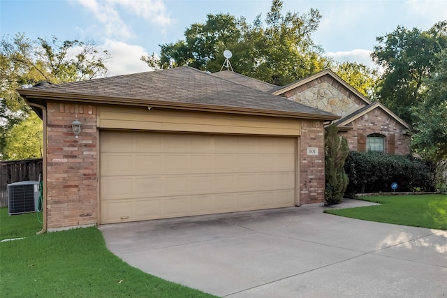 view of front facade featuring a front lawn, central air condition unit, and a garage