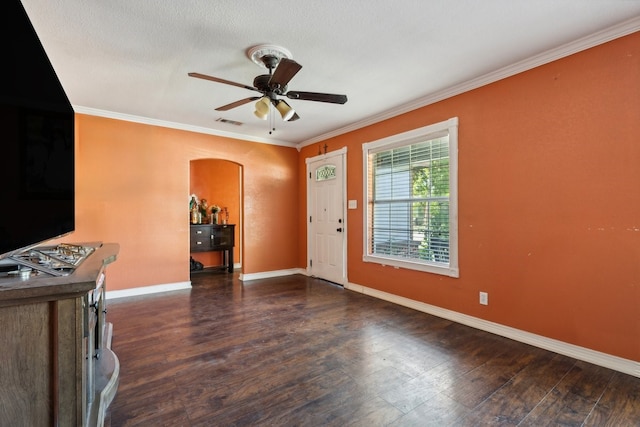 entryway featuring ornamental molding, dark hardwood / wood-style flooring, and ceiling fan