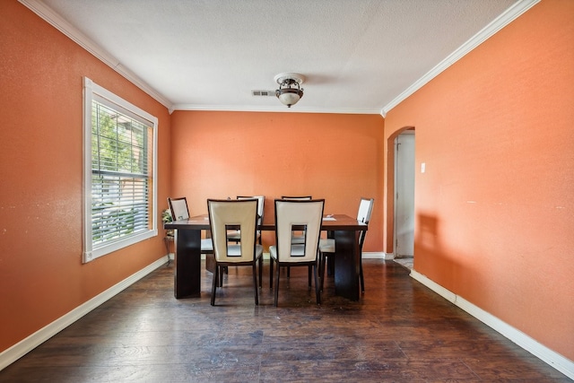 dining area with ornamental molding and dark wood-type flooring