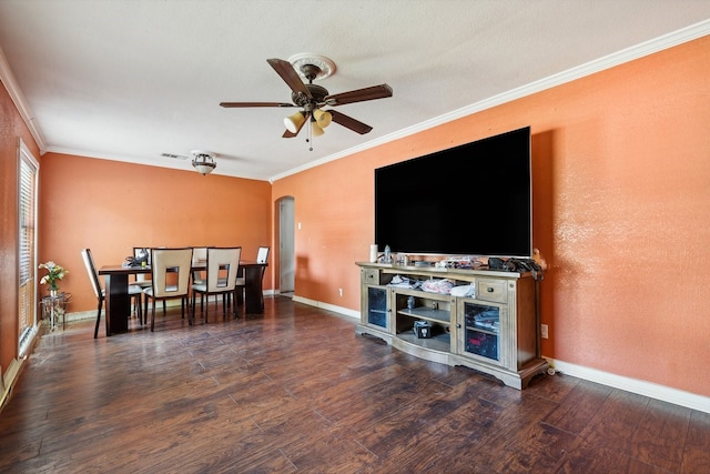 dining area featuring ornamental molding, ceiling fan, and dark hardwood / wood-style flooring