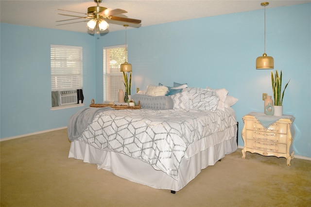 carpeted bedroom featuring cooling unit and ceiling fan