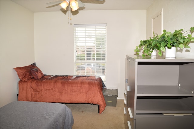 bedroom with ceiling fan and carpet flooring