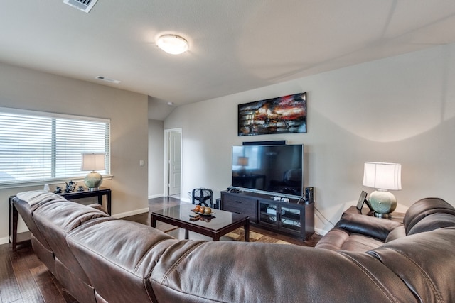 living room with lofted ceiling and dark wood-type flooring