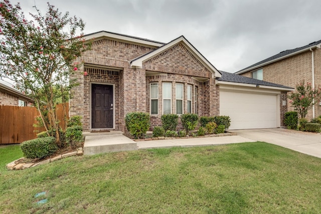 view of front of house with a front yard and a garage