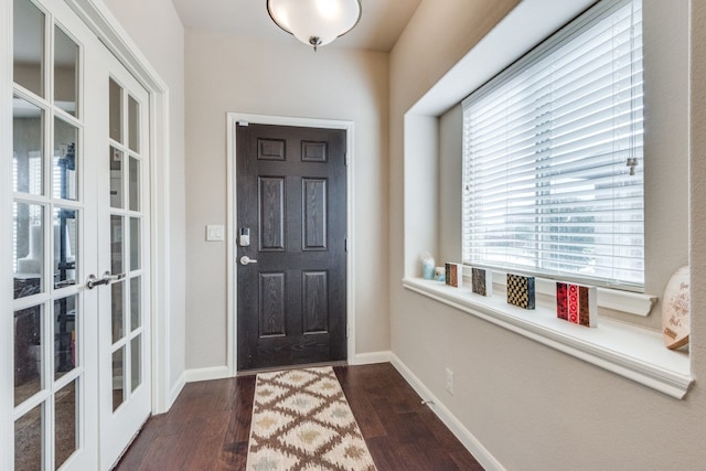 foyer with dark hardwood / wood-style flooring