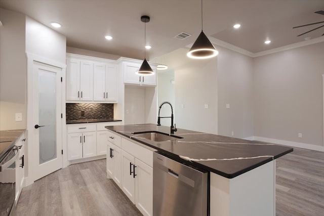 kitchen featuring an island with sink, white cabinetry, dishwasher, pendant lighting, and sink