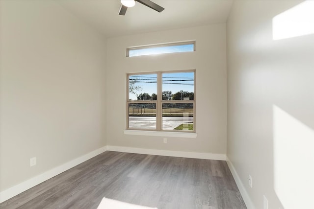 empty room featuring hardwood / wood-style flooring and ceiling fan