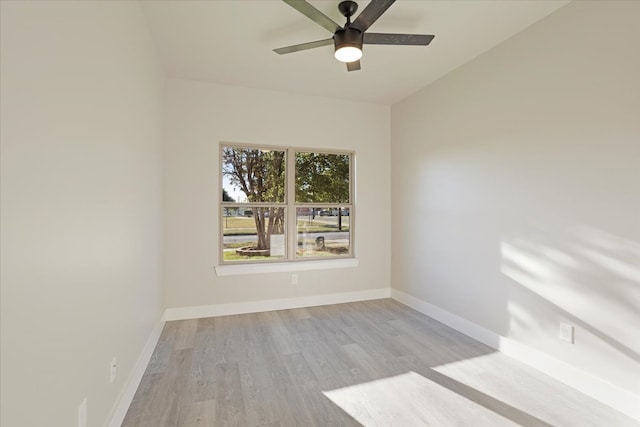 empty room with light hardwood / wood-style flooring and ceiling fan