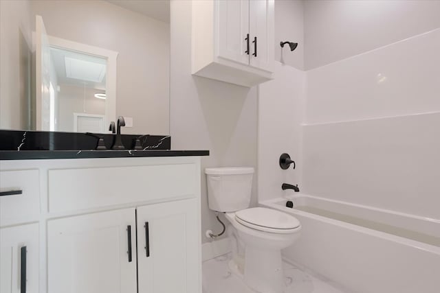 full bathroom featuring vanity, bathtub / shower combination, and toilet