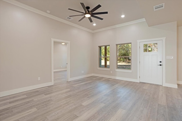 interior space with light hardwood / wood-style floors, ornamental molding, and ceiling fan