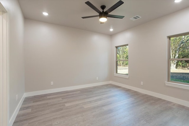 unfurnished room with light hardwood / wood-style flooring and ceiling fan