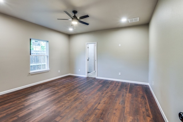 unfurnished room with dark hardwood / wood-style floors and ceiling fan