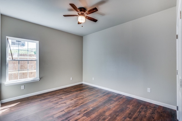 unfurnished room featuring dark wood-type flooring and ceiling fan