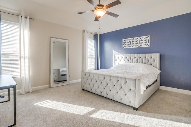 bedroom with multiple windows, carpet floors, and ceiling fan