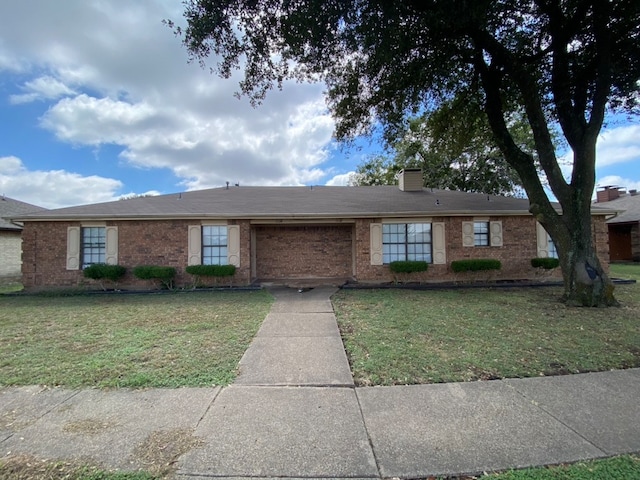 ranch-style house with a front yard