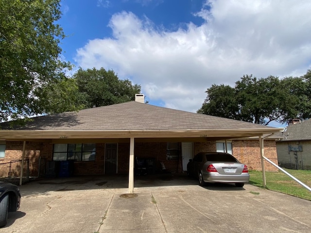 exterior space with a carport