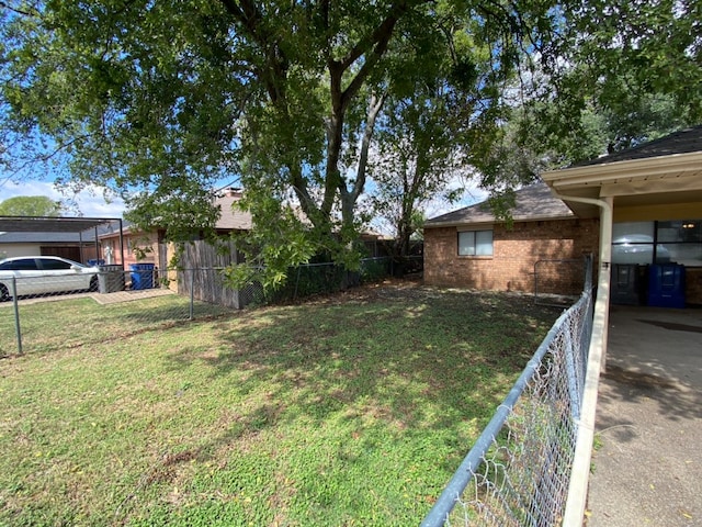 view of yard with a carport