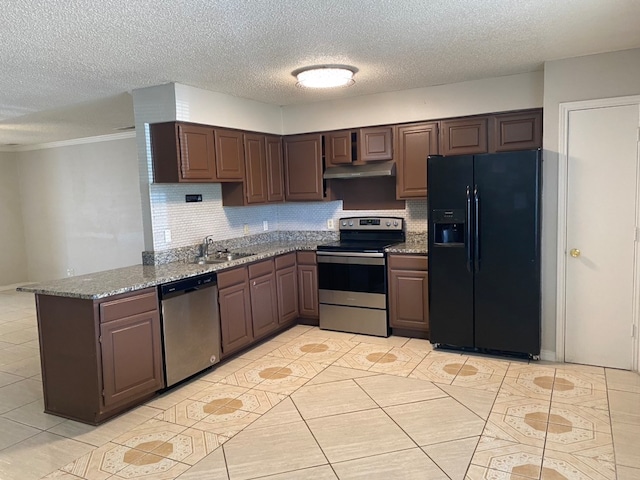 kitchen with range hood, appliances with stainless steel finishes, dark brown cabinetry, and sink