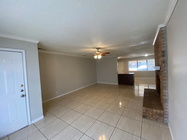 interior space with a brick fireplace, ceiling fan, a textured ceiling, and crown molding