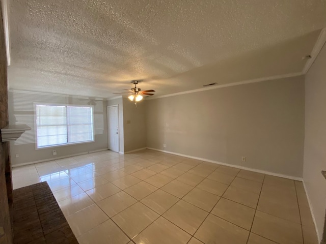 unfurnished room with a textured ceiling, light tile patterned floors, crown molding, and ceiling fan